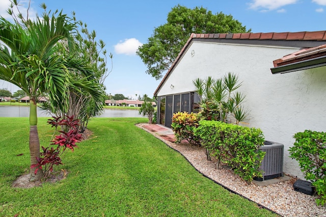 5707 Parkwalk Cir E, Boynton Beach, FL 33472 - view of green lawn featuring a sunroom and a water view