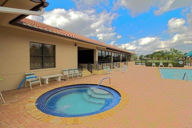 5707 Parkwalk Cir E, Boynton Beach, FL 33472 - community pool with a patio area