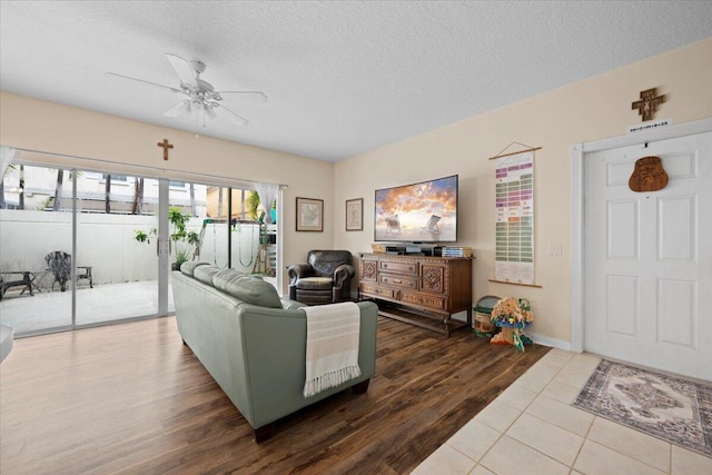 11 Live Oak Cir Unit 11, Tequesta, FL 33469 - living room with ceiling fan, wood finished floors, and a textured ceiling