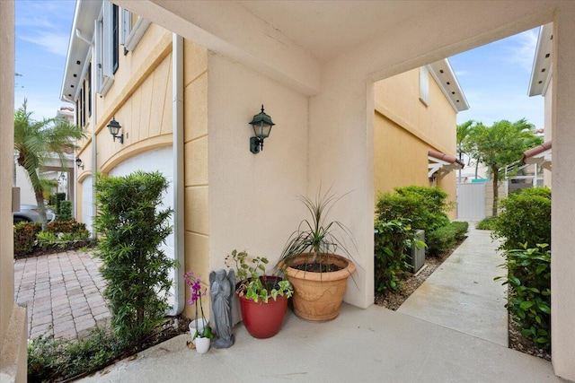 11 Live Oak Cir Unit 11, Tequesta, FL 33469 - doorway to property featuring stucco siding
