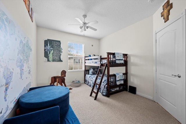 11 Live Oak Cir Unit 11, Tequesta, FL 33469 - carpeted bedroom featuring a textured ceiling and a ceiling fan
