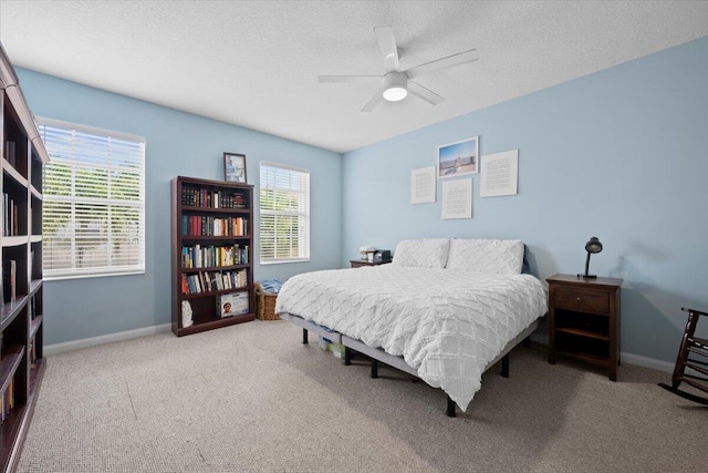 11 Live Oak Cir Unit 11, Tequesta, FL 33469 - bedroom with carpet, a textured ceiling, and ceiling fan
