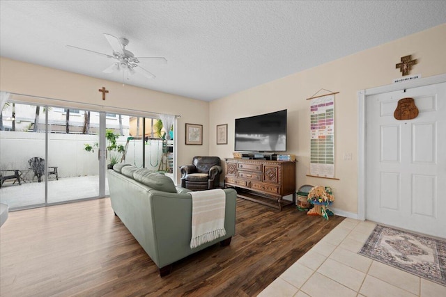 11 Live Oak Cir Unit 11, Tequesta, FL 33469 - living area with ceiling fan, wood finished floors, and a textured ceiling