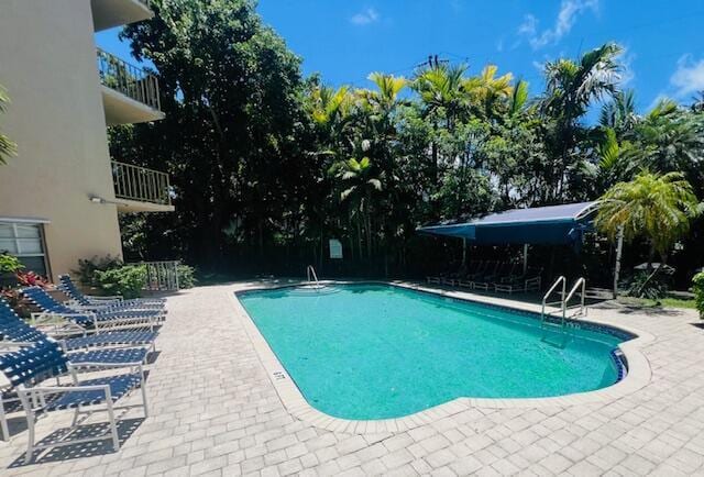 1120 99th St Unit 301, Bay Harbor Islands, FL 33154 - community pool featuring a patio area