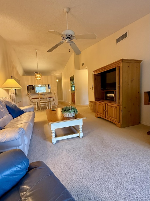 1142 Keystone Dr Unit C, Jupiter, FL 33458 - living room featuring lofted ceiling, a ceiling fan, and light carpet