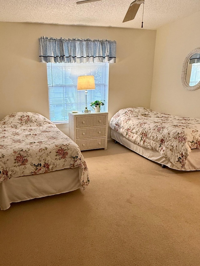 1142 Keystone Dr Unit C, Jupiter, FL 33458 - bedroom featuring a textured ceiling, light colored carpet, and ceiling fan