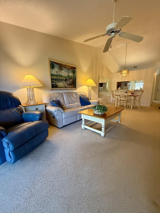 1142 Keystone Dr Unit C, Jupiter, FL 33458 - living area featuring carpet floors, a ceiling fan, vaulted ceiling, and a textured ceiling