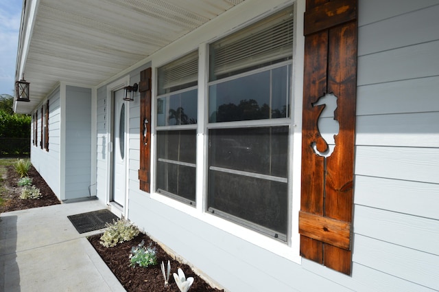 5447 SE 51st Dr, Stuart, FL 34997 - doorway to property with covered porch