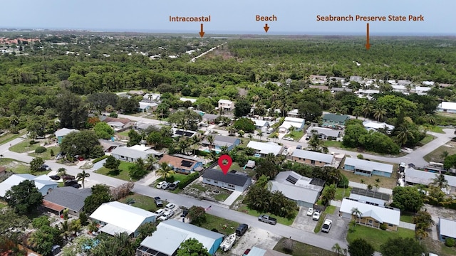 5447 SE 51st Dr, Stuart, FL 34997 - aerial perspective of suburban area with a heavily wooded area