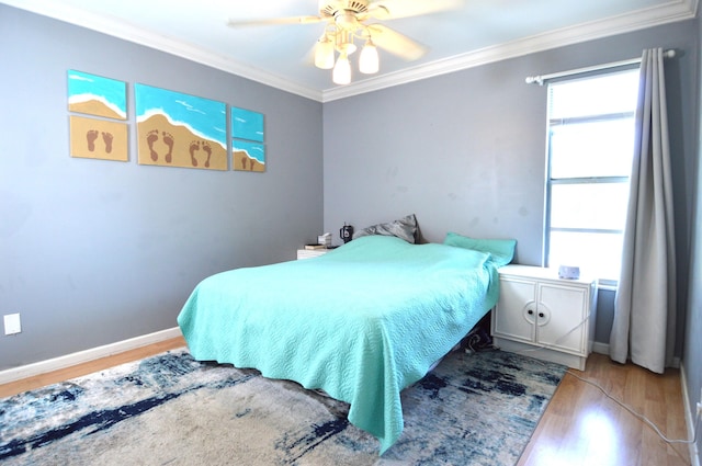5447 SE 51st Dr, Stuart, FL 34997 - bedroom with wood finished floors, crown molding, and a ceiling fan