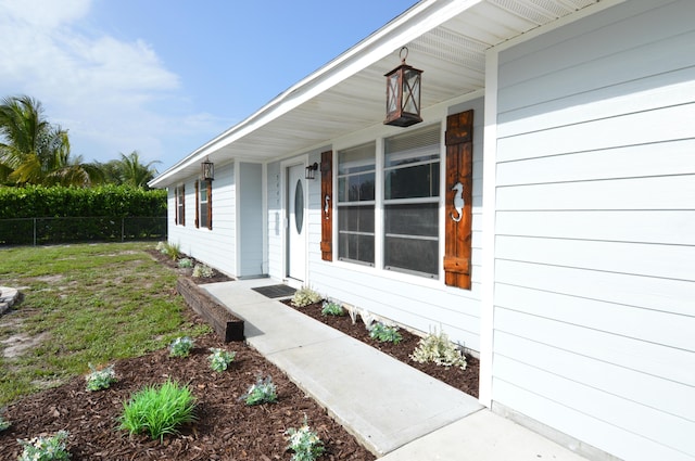 5447 SE 51st Dr, Stuart, FL 34997 - doorway to property with a porch