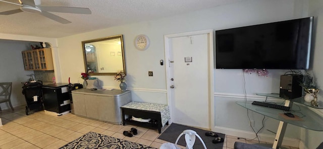 4732 Chariot Cir, Greenacres, FL 33463 - living room featuring ceiling fan, a textured ceiling, and light tile patterned floors