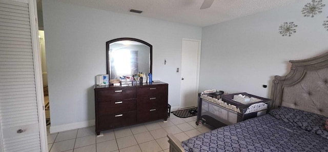 4732 Chariot Cir, Greenacres, FL 33463 - bedroom featuring light tile patterned floors, a textured ceiling, and a ceiling fan