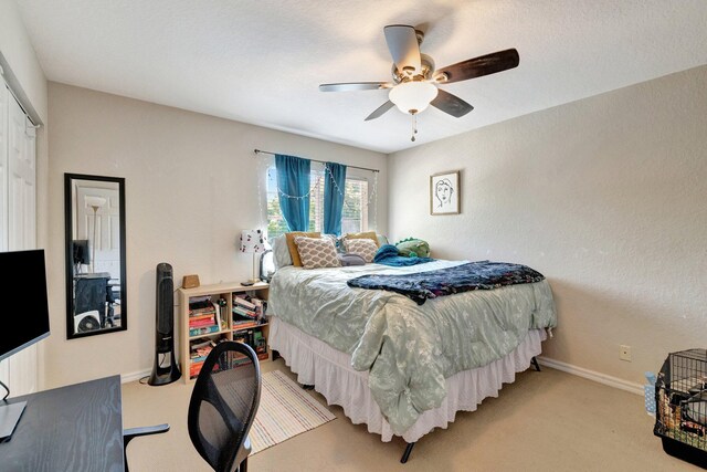 4454 SE Graham Dr, Stuart, FL 34997 - bedroom with light colored carpet and ceiling fan