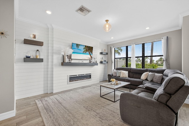 8343 Cinch Way, Lake Worth, FL 33467 - living room with ornamental molding, wood finished floors, a glass covered fireplace, and recessed lighting