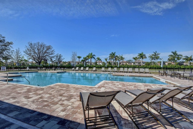 8343 Cinch Way, Lake Worth, FL 33467 - community pool with a patio area