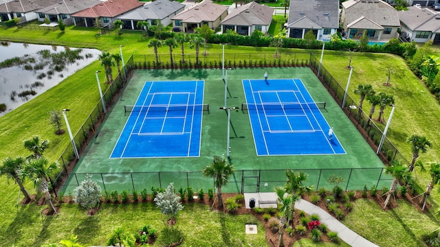 8343 Cinch Way, Lake Worth, FL 33467 - view of tennis court with a residential view and a water view