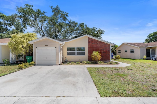 9890 W Heather Ln, Miramar, FL 33025 - view of front of house with an attached garage, driveway, a front yard, and brick siding
