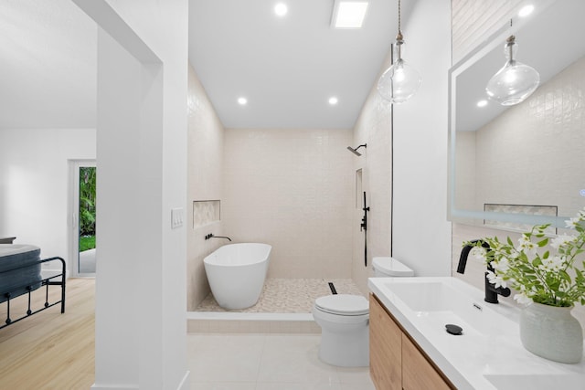 21436 Woodchuck Ln, Boca Raton, FL 33428 - full bathroom featuring vanity, a soaking tub, tiled shower, recessed lighting, and tile patterned floors