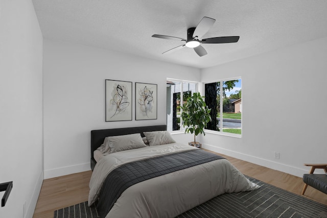 21436 Woodchuck Ln, Boca Raton, FL 33428 - bedroom with wood finished floors, a ceiling fan, and a textured ceiling