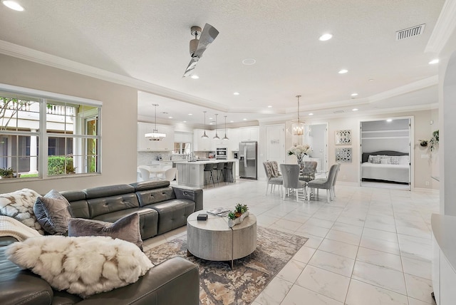 171 Tresana Blvd Unit 129, Jupiter, FL 33478 - living area featuring ornamental molding, light marble finish flooring, and recessed lighting