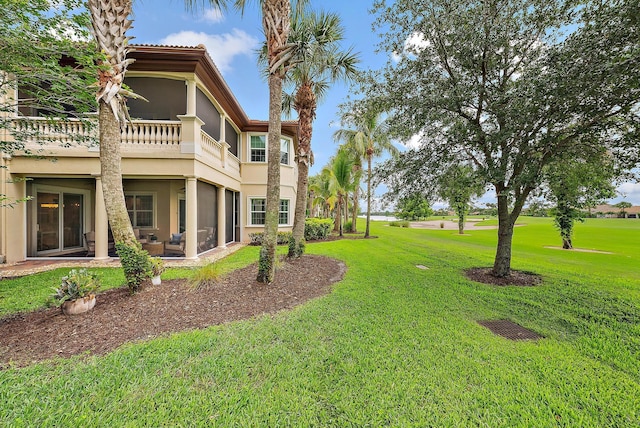 171 Tresana Blvd Unit 129, Jupiter, FL 33478 - view of grassy yard featuring a balcony and a patio area