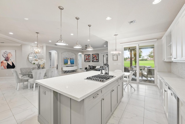 171 Tresana Blvd Unit 129, Jupiter, FL 33478 - kitchen with light marble finish floors, recessed lighting, arched walkways, a center island, and dishwasher