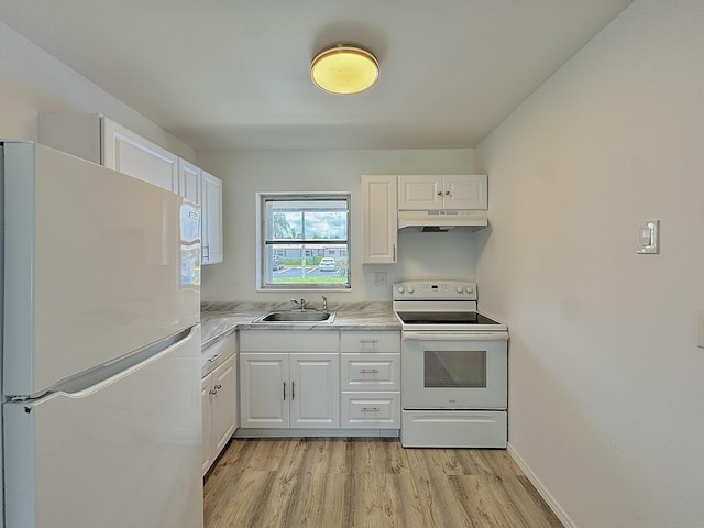 2885 Crosley Dr E Unit F, West Palm Beach, FL 33415 - kitchen featuring white appliances, under cabinet range hood, light wood-type flooring, light countertops, and white cabinets