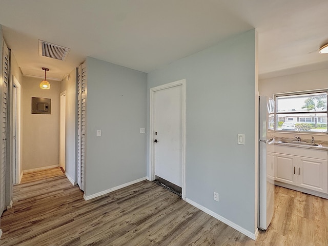 2885 Crosley Dr E Unit F, West Palm Beach, FL 33415 - hall featuring light wood-style flooring and a sink