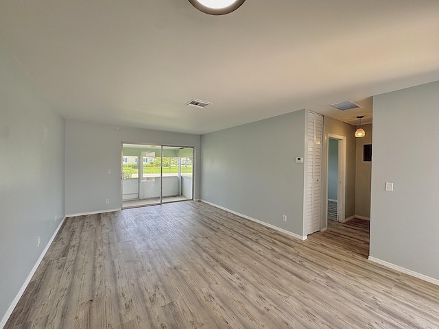 2885 Crosley Dr E Unit F, West Palm Beach, FL 33415 - spare room with light wood-style flooring and baseboards