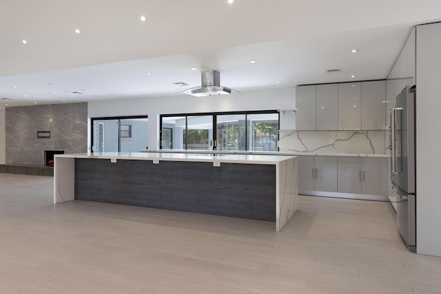 6532 Serena Ln, Boca Raton, FL 33433 - kitchen featuring modern cabinets, open floor plan, high end refrigerator, gray cabinetry, and light countertops