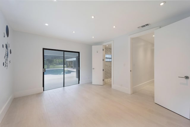 6532 Serena Ln, Boca Raton, FL 33433 - unfurnished bedroom featuring access to exterior, recessed lighting, and light wood-style floors