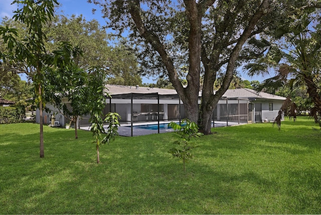 6532 Serena Ln, Boca Raton, FL 33433 - view of grassy yard with an outdoor pool and a lanai