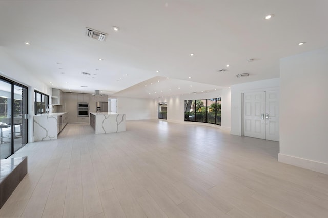6532 Serena Ln, Boca Raton, FL 33433 - unfurnished living room featuring recessed lighting and light wood-style floors