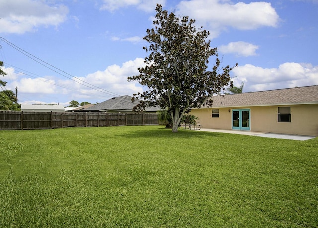 3126 SW Curcuma St, Port Saint Lucie, FL 34953 - fenced yard with french doors and a patio