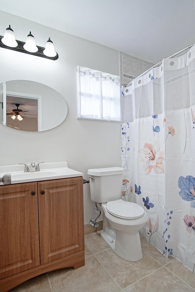 3126 SW Curcuma St, Port Saint Lucie, FL 34953 - full bathroom with vanity, ceiling fan, tile patterned floors, and a shower with shower curtain