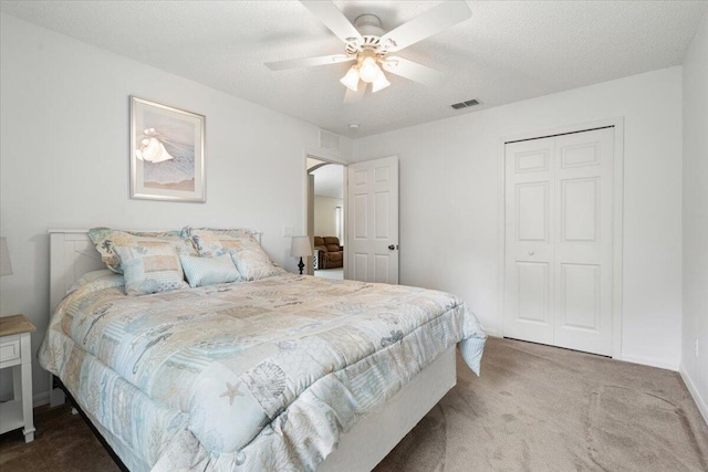 516 SW Crawfish Dr, Port Saint Lucie, FL 34953 - bedroom featuring carpet flooring, a closet, ceiling fan, and a textured ceiling