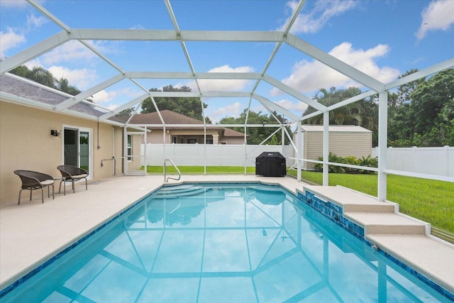 516 SW Crawfish Dr, Port Saint Lucie, FL 34953 - view of pool with a shed, a patio area, a fenced backyard, grilling area, and glass enclosure