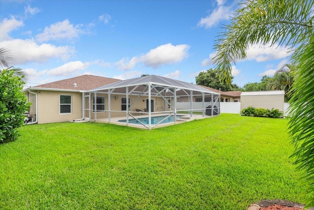 516 SW Crawfish Dr, Port Saint Lucie, FL 34953 - back of property with an outdoor pool, a patio, stucco siding, and a lanai