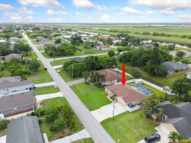 516 SW Crawfish Dr, Port Saint Lucie, FL 34953 - aerial perspective of suburban area featuring a large body of water