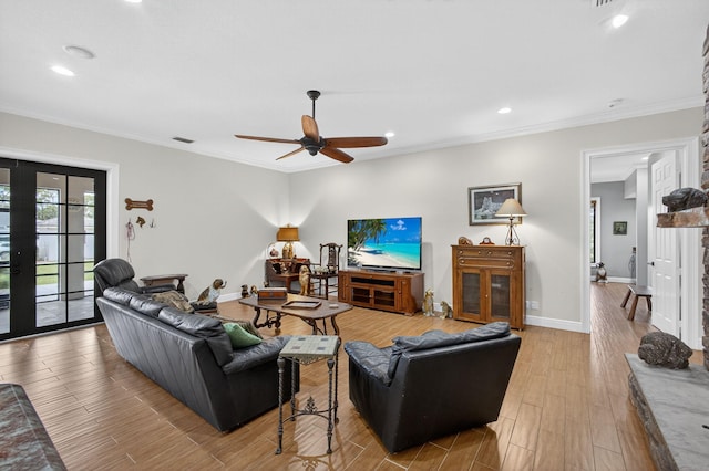 11085 86th St N, Palm Beach Gardens, FL 33412 - living room featuring recessed lighting, wood finished floors, french doors, ceiling fan, and crown molding