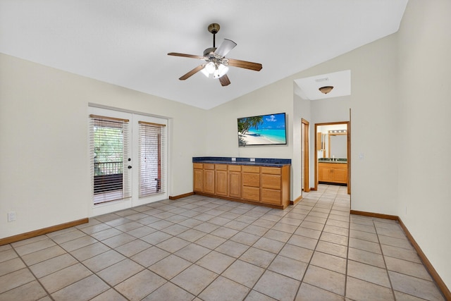 11085 86th St N, Palm Beach Gardens, FL 33412 - unfurnished living room with vaulted ceiling, a ceiling fan, and light tile patterned floors