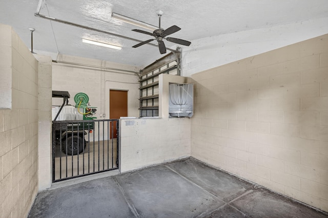 11085 86th St N, Palm Beach Gardens, FL 33412 - garage featuring concrete block wall and a ceiling fan