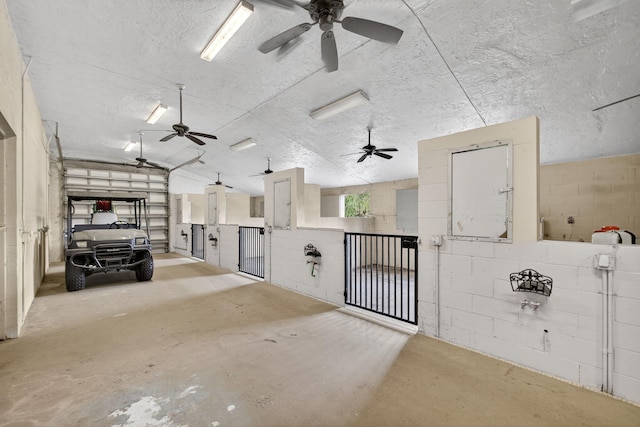 11085 86th St N, Palm Beach Gardens, FL 33412 - interior space featuring a ceiling fan and concrete block wall