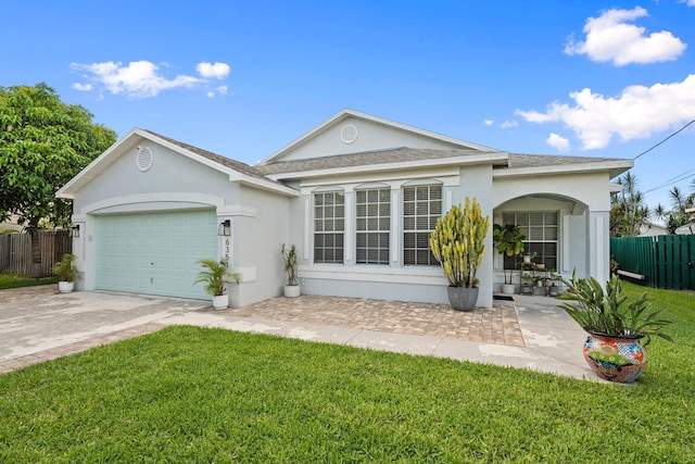 6351 Adams St, Jupiter, FL 33458 - single story home with stucco siding, concrete driveway, a garage, and a shingled roof