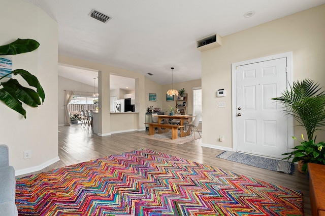6351 Adams St, Jupiter, FL 33458 - foyer entrance featuring wood finished floors and lofted ceiling