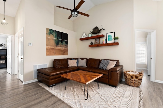 6351 Adams St, Jupiter, FL 33458 - living area featuring high vaulted ceiling, wood finished floors, and a ceiling fan