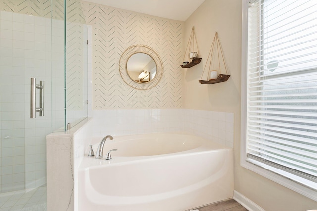 6351 Adams St, Jupiter, FL 33458 - bathroom with wallpapered walls, a tile shower, and a garden tub
