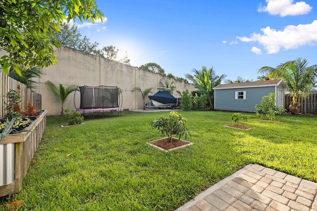 6351 Adams St, Jupiter, FL 33458 - fenced backyard with a trampoline and an outdoor structure