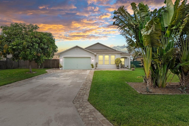 6351 Adams St, Jupiter, FL 33458 - view of front facade featuring concrete driveway, stucco siding, and a garage